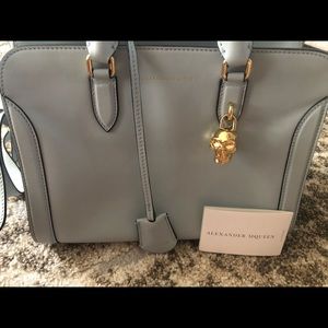 satchel complete with gold tone  skull charm